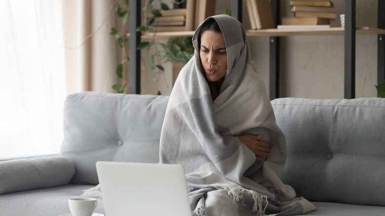 woman cold with blanket