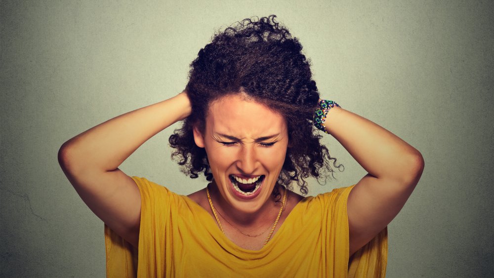 Stressed woman pulling hair