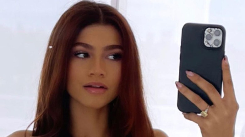 Zendaya taking a selfie of her new red hair 