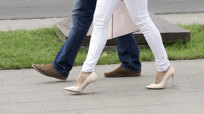 woman high heels man walking couple