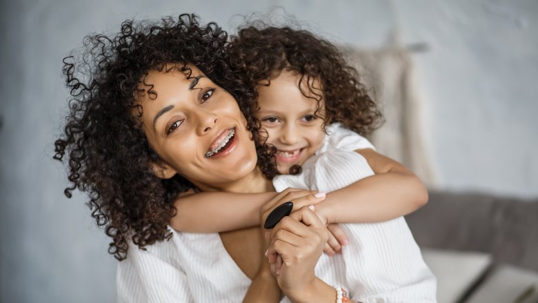 Mother and young daughter procrastinate