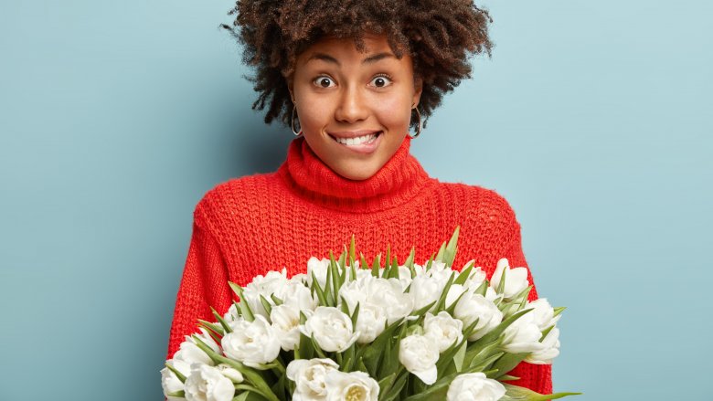 woman giving flowers