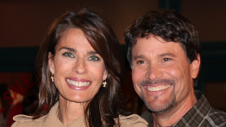 Peter Reckell and Kristian Alfonso pose for a photo. 