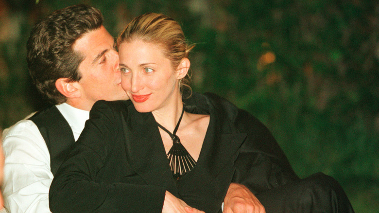 John F. Kennedy Jr. kissing Carolyn Bessette on the cheek