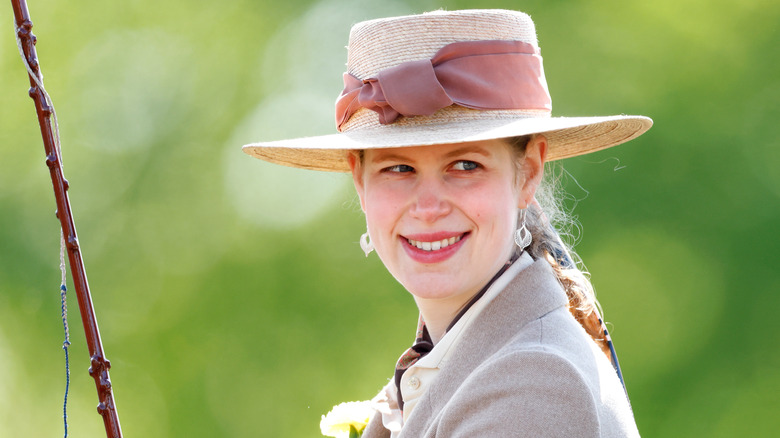 Lady Louise Windsor smiling over her shoulder 