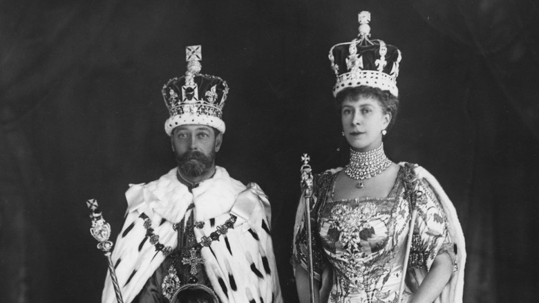 King George V and Queen Mary posing in their coronation crowns