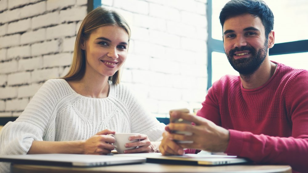 man and woman having coffee