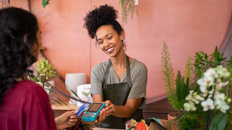 woman buying from local business