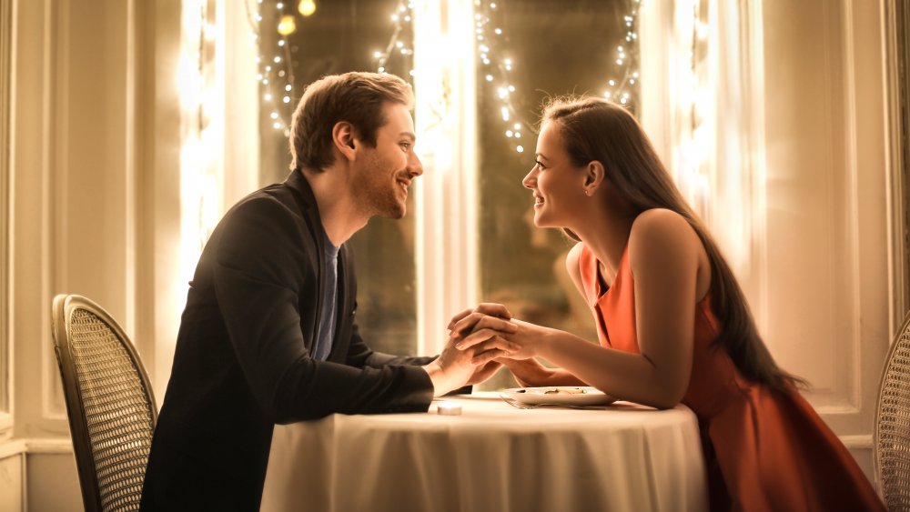 Couple talking at dinner