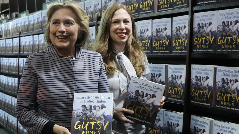 Hillary and Chelsea Clinton holding their book