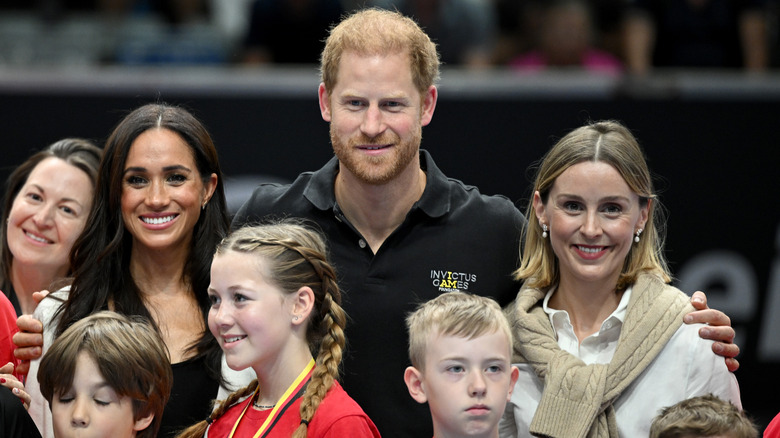 Meghan Markle and Prince Harry posing for a photo