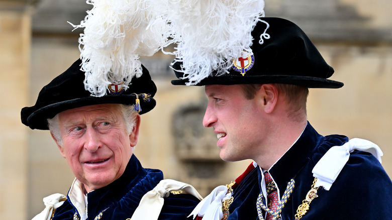 King Charles and Prince William share a laugh in jaunty hats