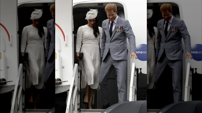 Meghan and Harry leaving jet during royal tour