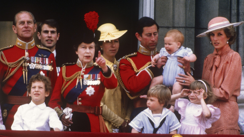 Royal family balcony with baby Prince Harry fussing
