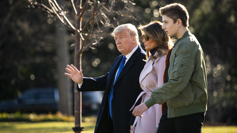 Donald, Melania Trump and Barron Trump walking 