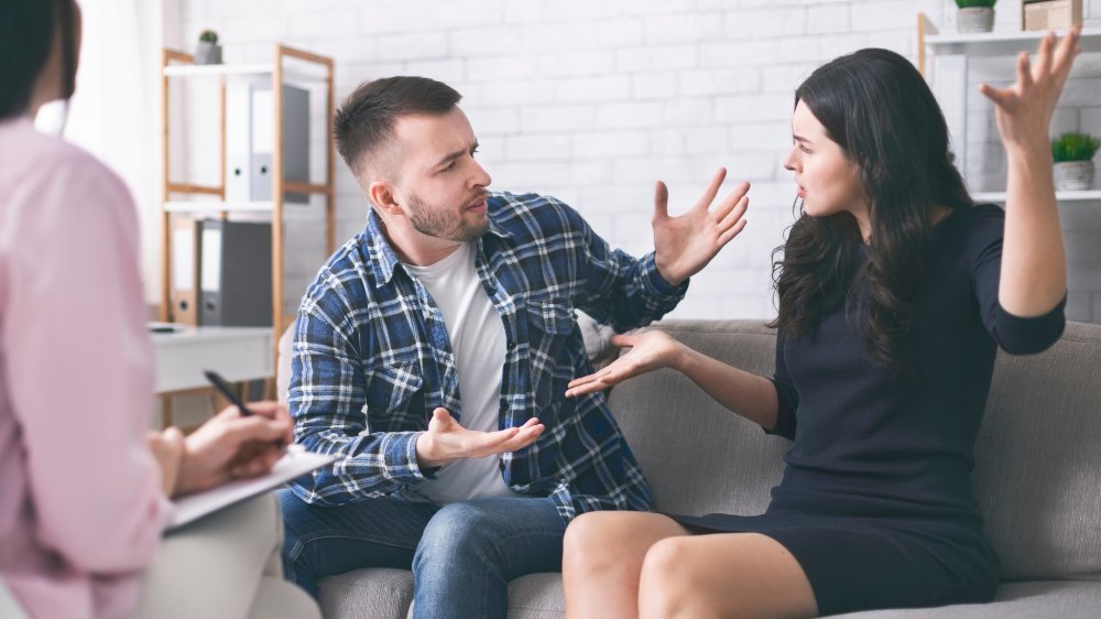 Couple fighting with therapist