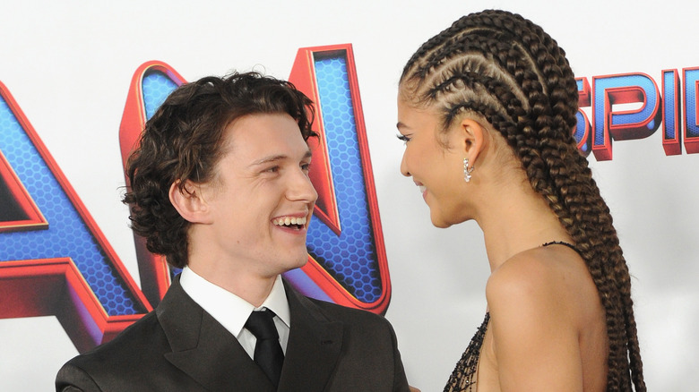 Zendaya and Tom Holland laughing on the red carpet