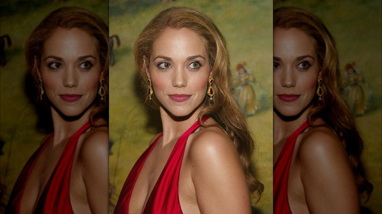 Elizabeth Berkley looking off to the side