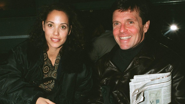 Elizabeth Berkley smiling with Roger Wilson