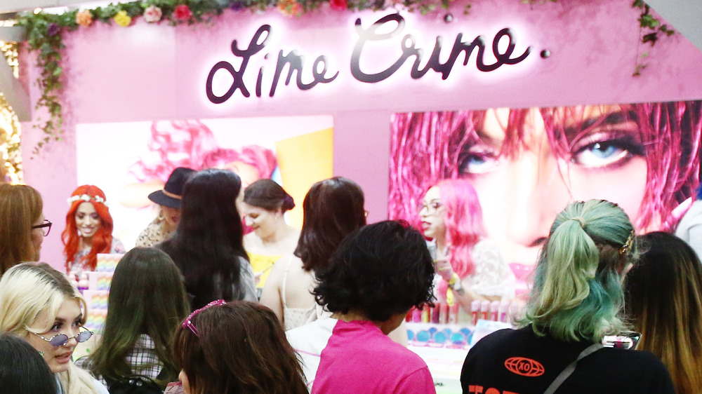 Lime Crime booth filled with cosmetic products