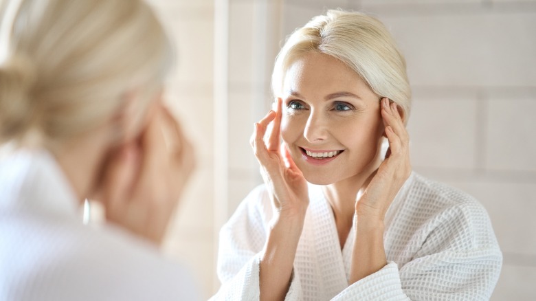 Woman looking in the mirror