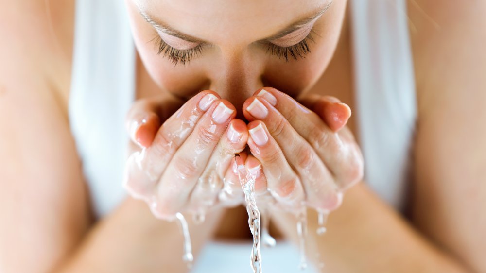 Woman washing face