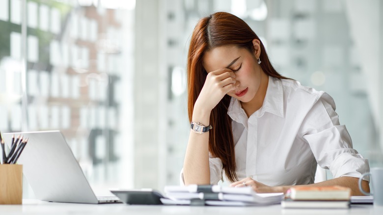 Stressed businesswoman at office