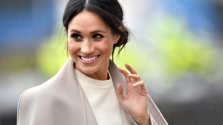 Meghan Markle waving coyly