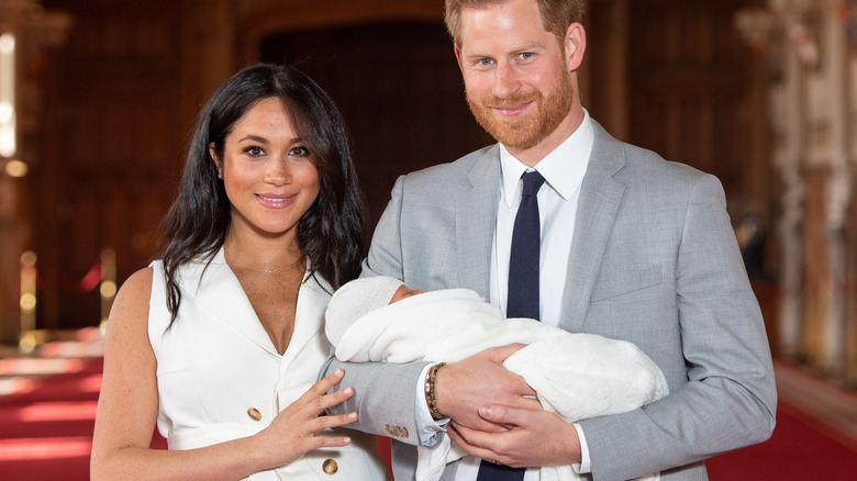 Meghan Markle and Prince Harry pose with baby Archie