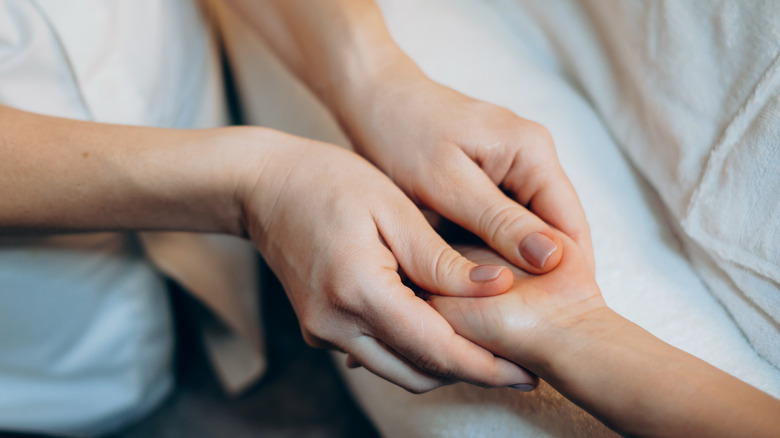 Close up of woman receiving hand massage