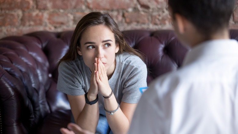 Woman listening to a man speak