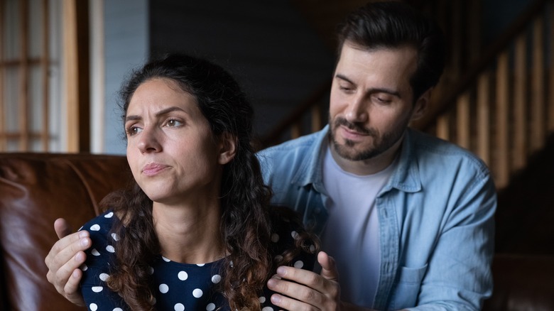 Couple looking sad