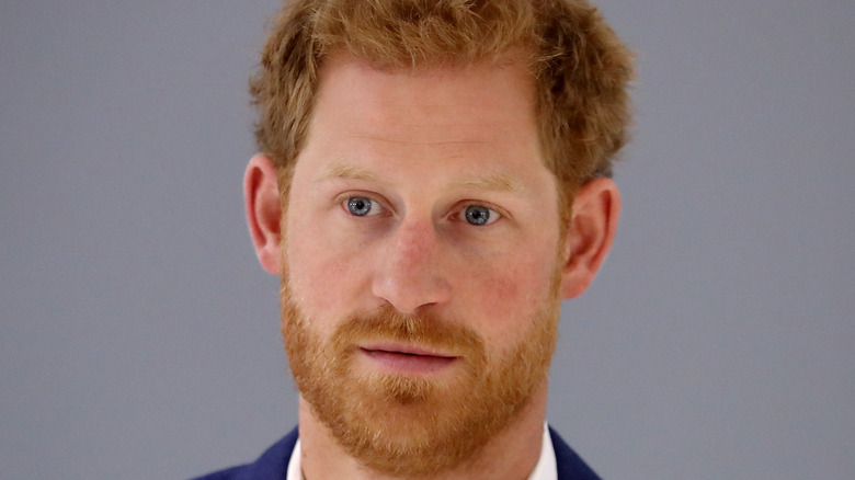 Prince Harry looks stony-faced