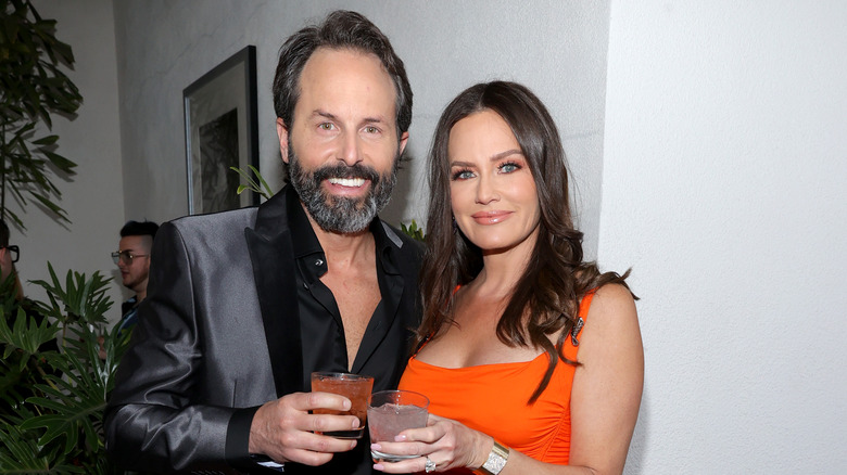 Seth and Meredith Marks holding drinks at event 