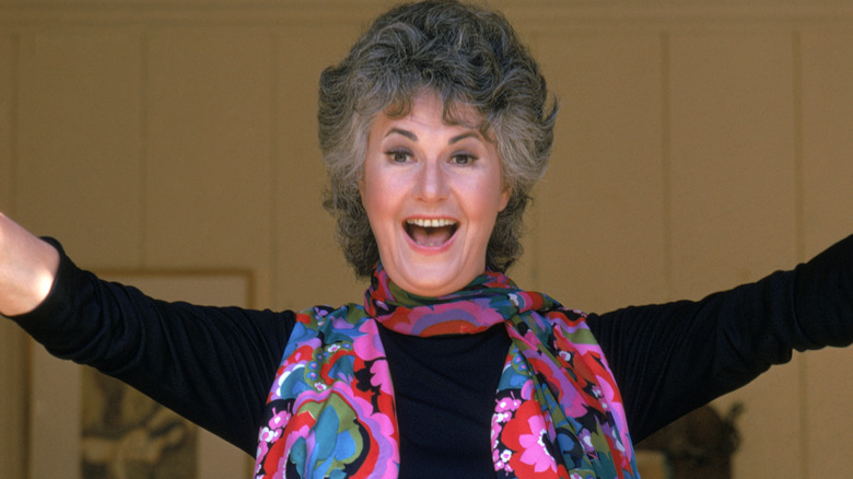 Bea Arthur with her arms up