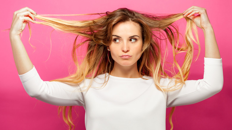 Woman disappointed with her dry shampoo 