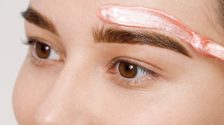 Applying hard wax on eyebrows