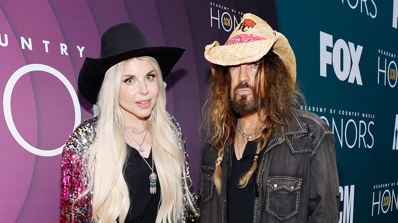 Billy Ray Cyrus poses with his new wife, Firerose