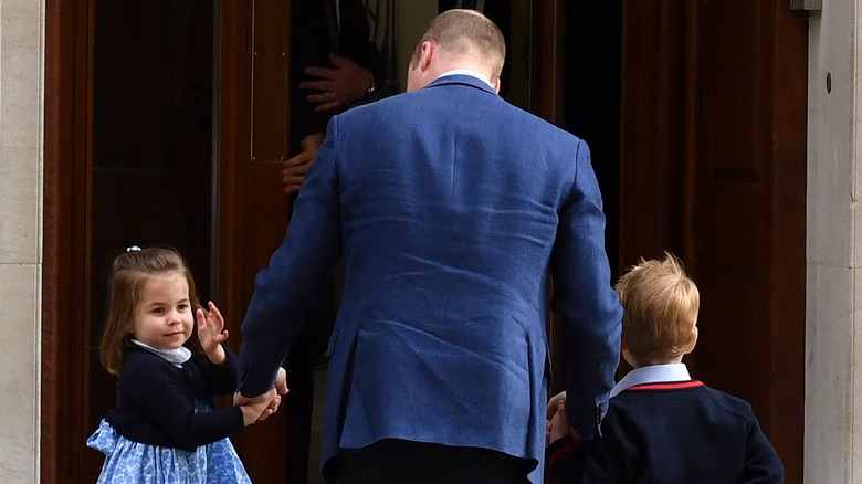 one of the royal children Princess Charlotte waving to public