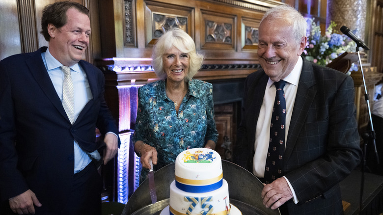 Tom Parker Bowles, Queen Camilla, and Gyles Brandreth 