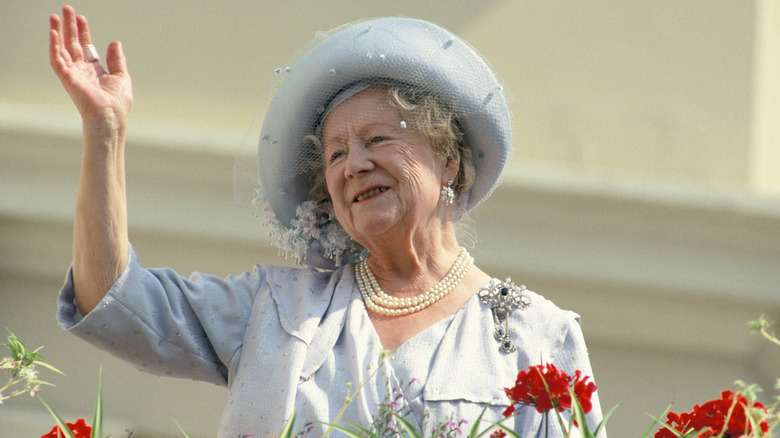 The Queen Mother waving