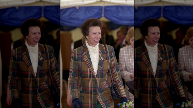 Princess Anne in tartan coat smiling