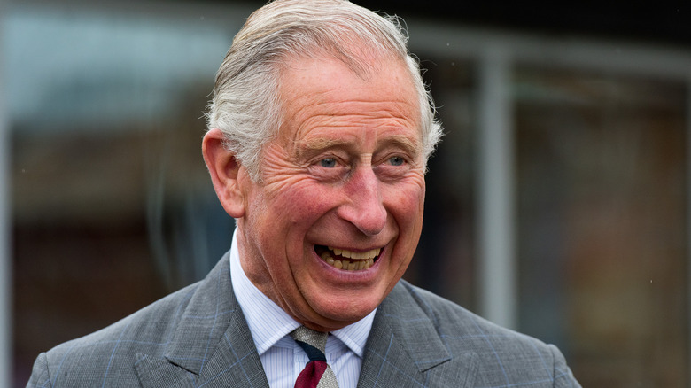 King Charles III laughing