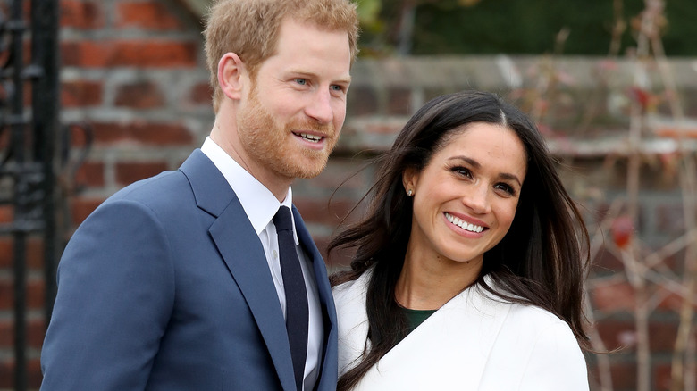 Prince Harry and Meghan Markle smiling