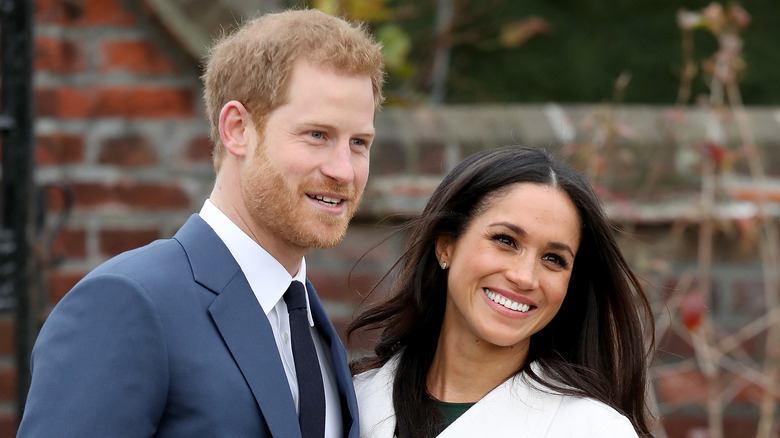 Prince Harry and Meghan Markle smiling