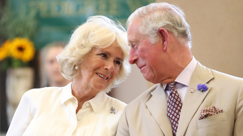 Queen Consort Camilla and King Charles gazing fondly at each other