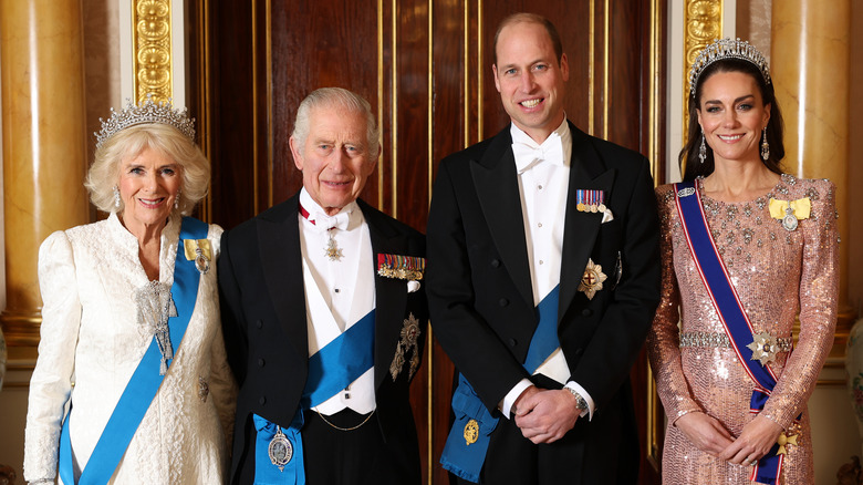 King Charles, Queen Camilla, Prince William, and Princess Catherine standing together