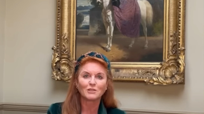 Sarah Ferguson, gold-framed painting behind her