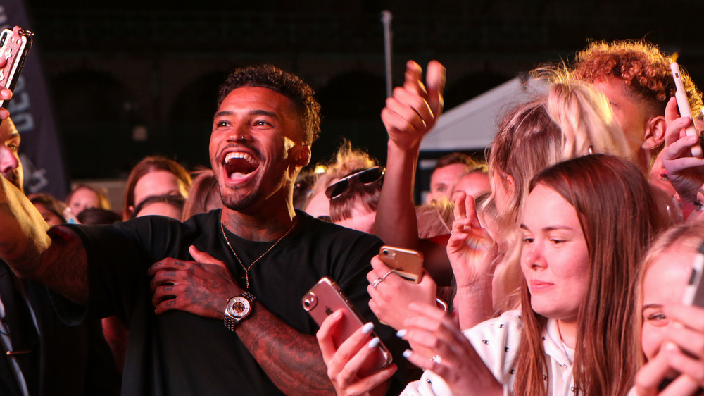 Love Island contestant with fans 