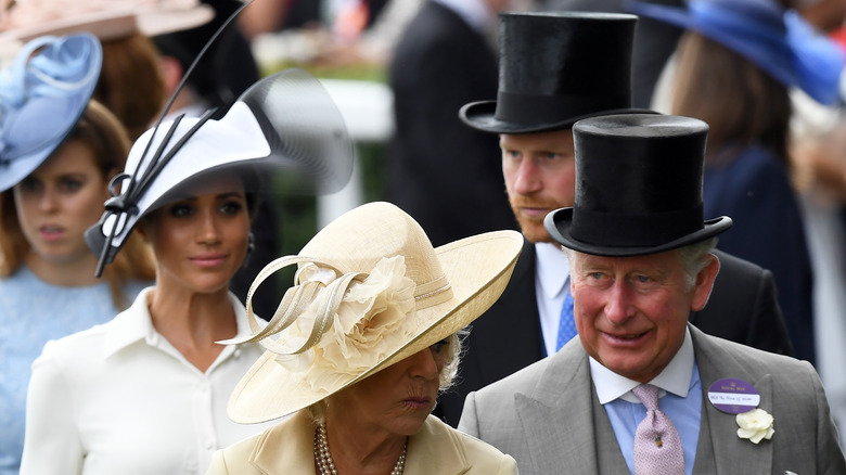 Meghan Markle and Prince Harry walk behind Camilla and Charles